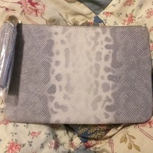 Gili pebble leather snow leopard wristlet